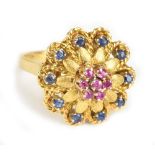 An 18ct yellow gold floral gem set ring with textured domed mount, size L, approx 6.2g.Additional