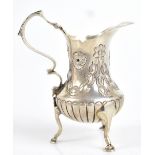 MATTHEW JOHN JESSOP; an Edward VII hallmarked silver cream jug, with repoussé floral detail and