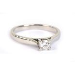 A platinum and diamond solitaire ring, the brilliant cut stone weighing approx 0.20cts, in four claw