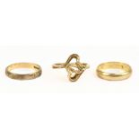Three 9ct yellow gold rings comprising an interlocking heart example, size N, a plain wedding