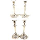 Two pairs of silver plated candlesticks, both with tapered stems, height of foliate decorated