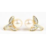 A pair of yellow metal pearl and diamond ear studs, stamped 750, approx 3.2g.Additional