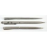 SHEAFFER; a sterling silver cased ballpoint pen with bright cut foliate detail, a further plated
