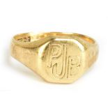 A 9ct yellow gold gentleman's signet ring, engraved with initials 'PJB', size S 1/2, approx 6.6g.