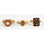 Three 9ct yellow gold rings including panelled signet ring set with a stylised capital S, size K 1/