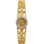 OMEGA; a lady's vintage 18ct yellow gold wristwatch, with twenty diamonds to the bezel and