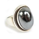 GEORG JENSEN; a silver and hematite cabochon ring, 46A, with maker's mark and stamped 925 Denmark to