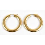 A pair of 9ct yellow gold hoop earrings, diameter 3.8cm, approx 7.8g (2).Additional