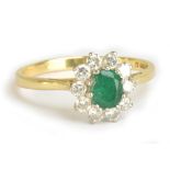 An 18ct yellow gold diamond and emerald cluster ring, size Q, approx 3.1g.Additional