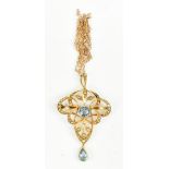 An Edwardian 15ct yellow gold seed pearl and blue spinel pendant with open work frame and