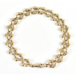 A late 19th/early 20th century 9ct yellow gold fancy link bracelet, length 21cm, approx 33.2g.