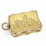NATHANIEL MILLS; a Victorian hallmarked silver castle top vinaigrette of shaped rectangular form,