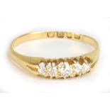 An 18ct yellow gold and diamond five stone ring, the central diamond weighing approx 0.07cts, size O