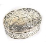 A late Victorian Continental hallmarked silver oval trinket box, the lid embossed with two fairies