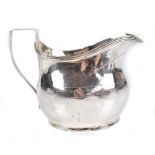 WILLIAM WESTON; a George III hallmarked silver cream jug of bellied oval form, with band of Greek