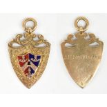 A 9ct yellow gold, red and blue enamel decorated shield shaped fob inscribed 'J.H. Shortland',