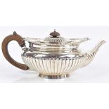EDWARD BARNARD & SONS LTD; a Victorian hallmarked silver teapot of squat form with gadrooned lower