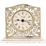 BARKER ELLIS & CO; an Elizabeth II hallmarked silver mantel clock, with pierced floral detail