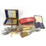 A group of silver plated items, including cased fish knives and forks, tray, napkin rings, etc.