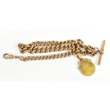 A 9ct yellow gold graduated watch chain with single spring loaded clip T-bar and half guinea fob,