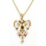 A 9ct yellow gold open work Art Nouveau pendant set with green stones, on 9ct yellow gold chain,