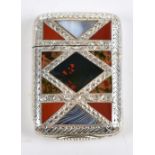 A Victorian hallmarked silver vesta case with inlaid Scottish agate inside a double band of chased