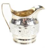 ROBERT & DAVID HENNELL; a George III hallmarked silver cream jug with band of embossed and