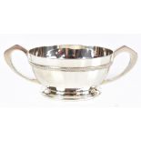 DEAKIN & FRANCIS; a George V hallmarked silver twin handled footed bowl with panelled decoration,