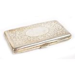 A late Victorian hallmarked silver cigarette case of rounded rectangular form, with engraved