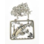 GEORG JENSEN; a Hawaii dolphin pendant on chain, circa 1950, designed by Arno Malinowski, no.94