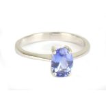 An 18ct white gold and Tanzanite ring, size N 1/2, approx 2.8g, the glass measures approx 7.95 x 5.