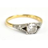 An 18ct yellow gold and platinum set diamond solitaire ring, diamond weight approx 0.5cts, with