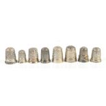 CHARLES HORNER; a group of eight hallmarked silver thimbles including a Dorcas no.3 and a floral