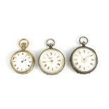 Two silver key wind fob watches with enamel dials set with Roman numerals, and a silver gilt fob