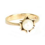 A 9ct yellow gold and cultured pearl dress ring, size O, approx 2.8g.Additional InformationIn good