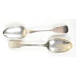 A pair of George IV hallmarked silver Fiddle pattern dessert spoons engraved with a claw armorial,