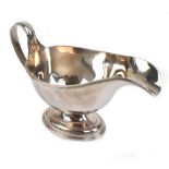 CJ VANDER LTD; an Elizabeth II hallmarked silver sauce boat with cast rims, Sheffield 1964, length