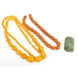 Two amber-type bead necklaces, size of largest bead 1.7 x 2.5cm, length of necklace 96cm, and a 20th