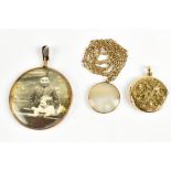 Three 9ct yellow gold pendants including a hallmarked locket with foliate scroll decoration, a