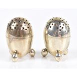 RICHARD SIBLEY I; a pair of Victorian hallmarked silver novelty pepperettes modelled in the form