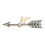 An unmarked white metal brooch formed as Cupid's arrow set with diamonds including approx 0.2cts