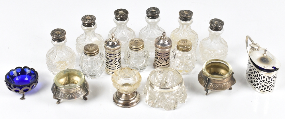 A group of late 19th/early 20th century hallmarked silver mounted and topped items including mustard