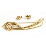 A 14ct yellow gold abstract brooch and matching earrings with stamped import marks, approx 10.6g.