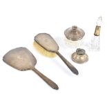 ADIE BROS LTD; an Elizabeth II hallmarked silver two-piece dressing table set, comprising hand