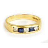 An 18ct yellow gold channel set diamond and sapphire ring, size P, approx 4.2g.Additional