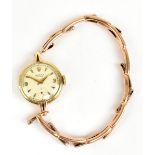 ROLEX; a 9ct yellow gold cased lady's wristwatch, the dial set with baton numerals and subsidiary