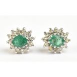 A pair of 9ct yellow gold emerald and diamond cluster earrings, approx 1.4g.Additional