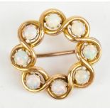 A 15ct yellow gold and opal circular brooch, diameter 2.5cm, approx 4.9g.Additional InformationThere
