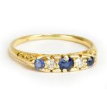An 18ct yellow gold five stone sapphire and diamond ring, size L 1/2, approx 2.3g.Additional