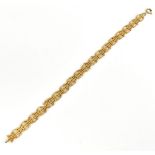 A 9ct yellow gold fancy link bracelet, sold with original receipt 1983, length 8.5cm, approx 7.1g.